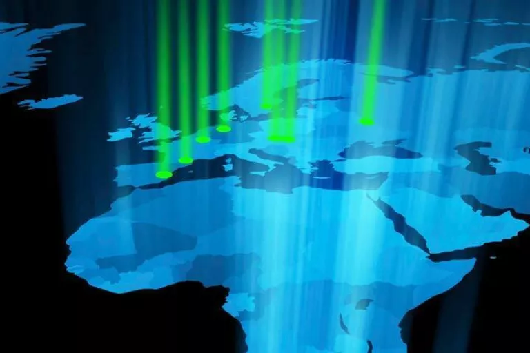 Map of the world with light beams streaming down indicating Nikon Centers of Excellence