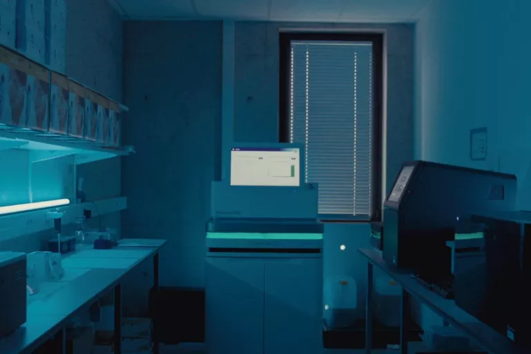 Dark room full of equipment at the VIB Nucleomics Core