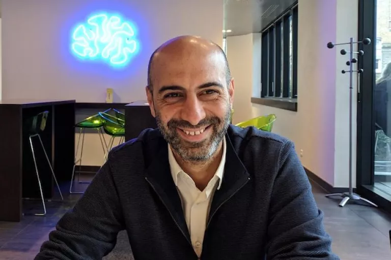 Group leader alumni Bassem Hassan smiling into the camera