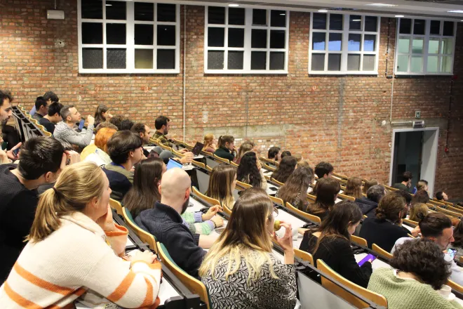 Attendees listening to Keynote PhD Symposium